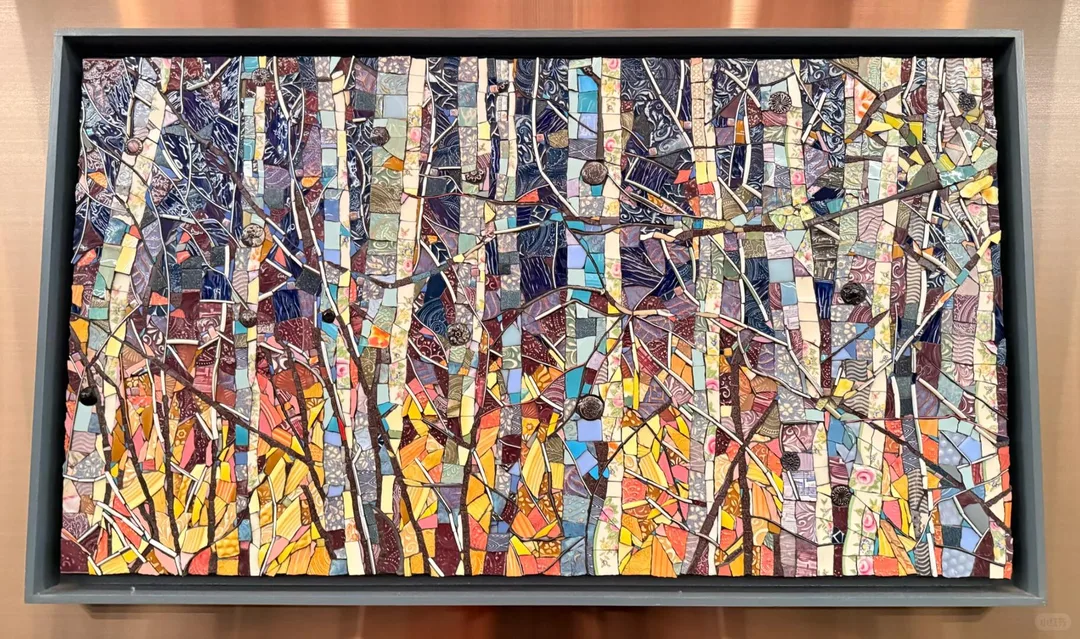 Colorful abstract birch forest artwork inside the MSP Delta Sky Club