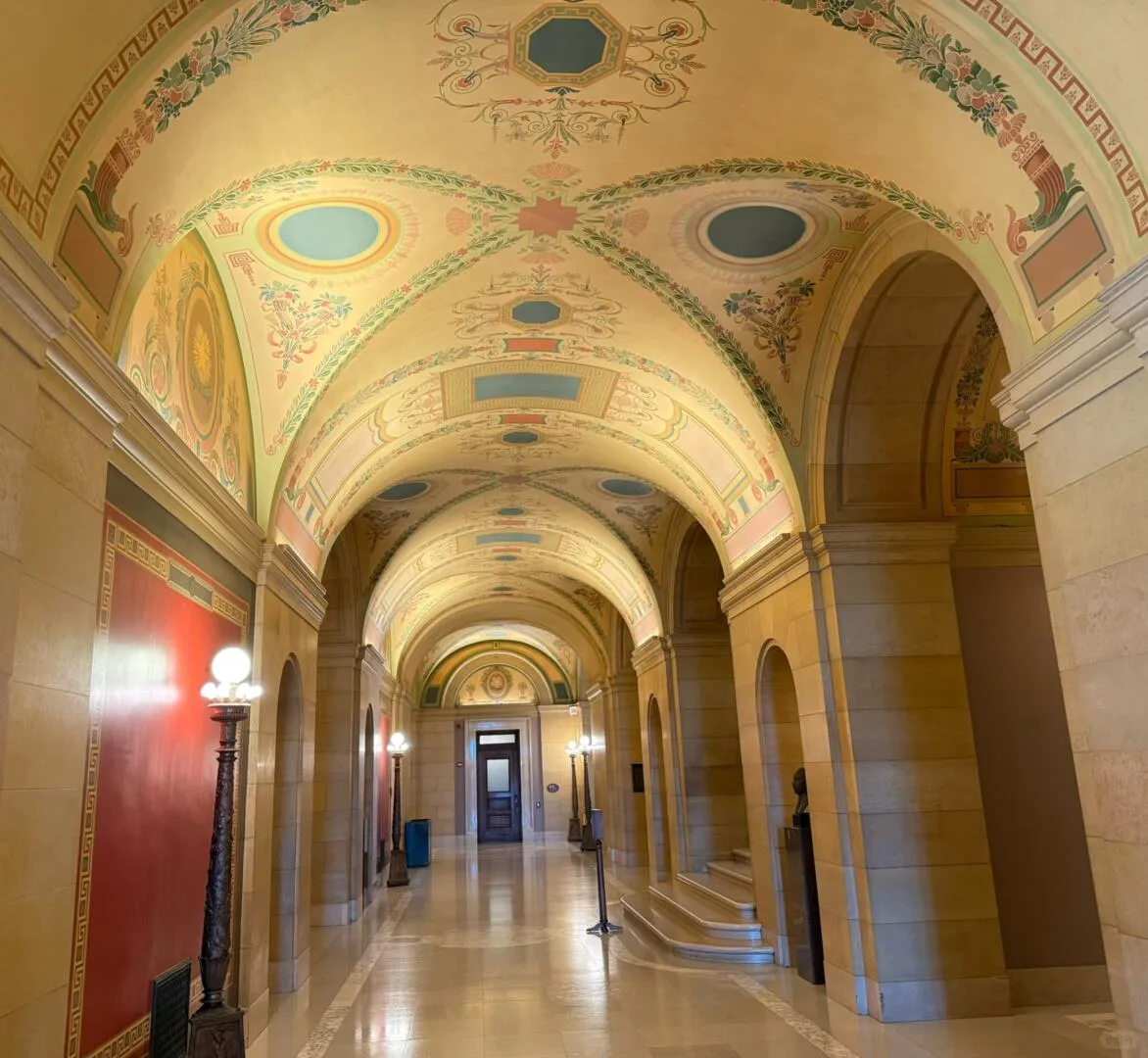 Long vaulted marble corridor inside the Minnesota State Capitol