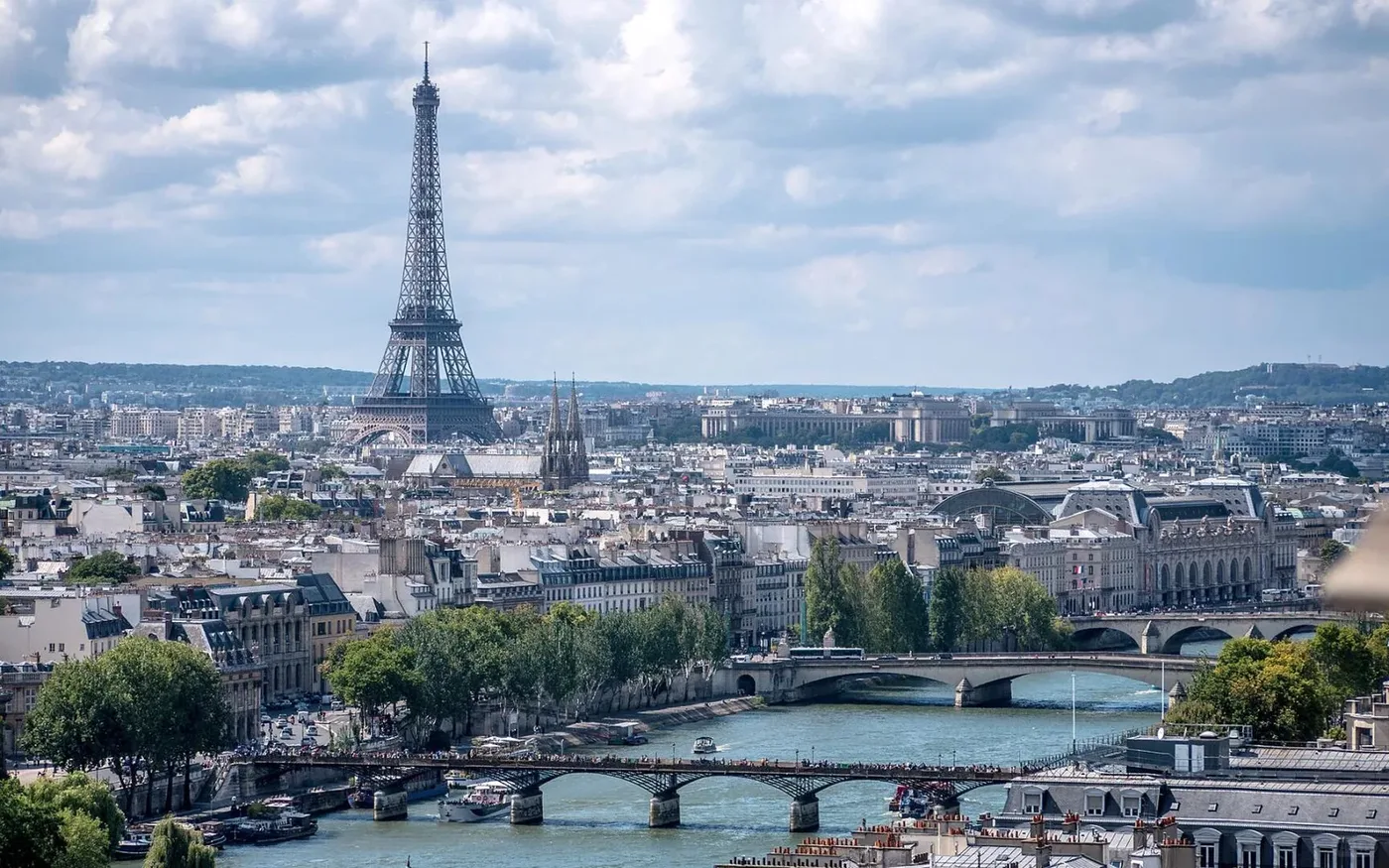 Eiffel Tower rising above the Paris skyline and Seine